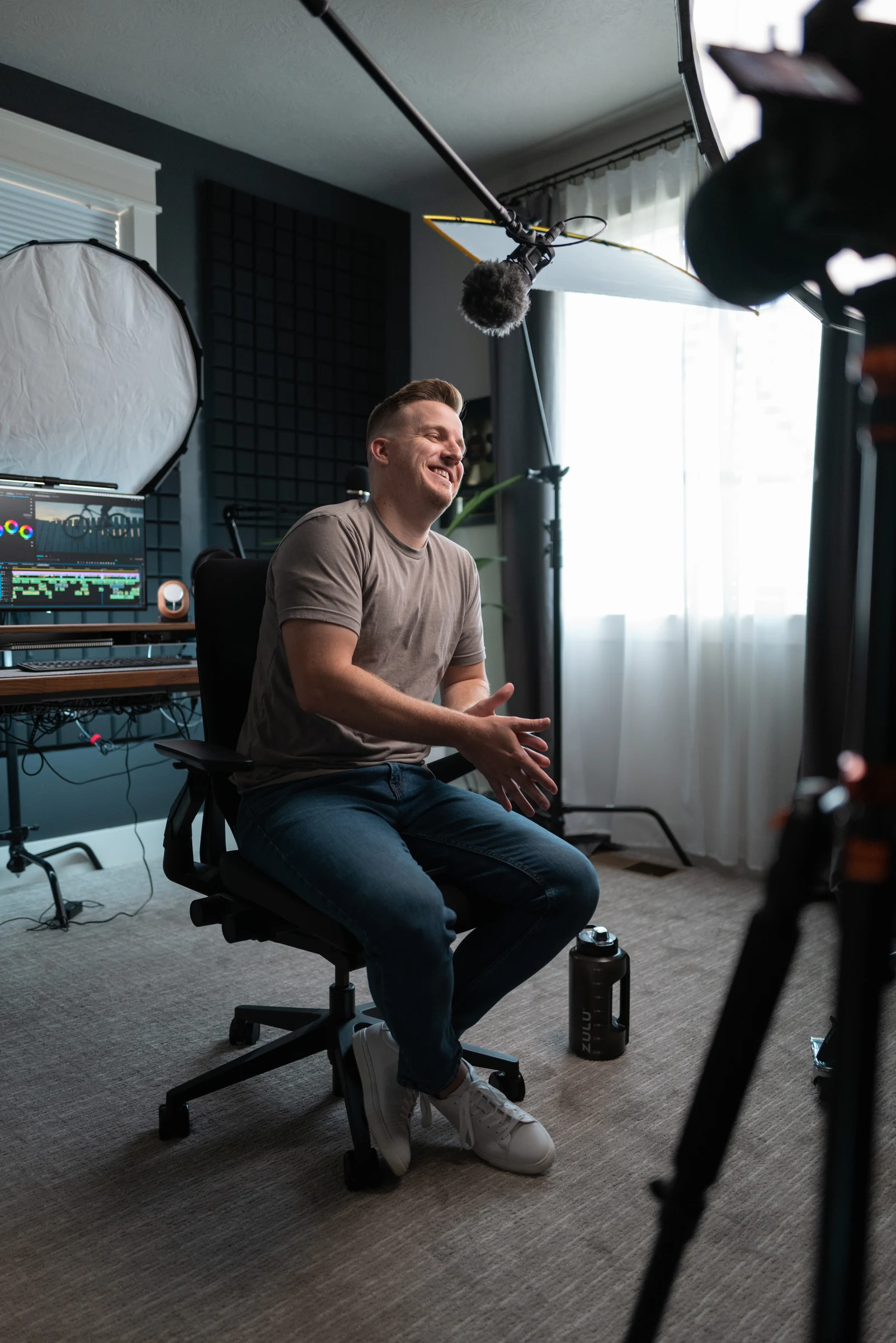 Eric laughing during a shoot in his creative studio